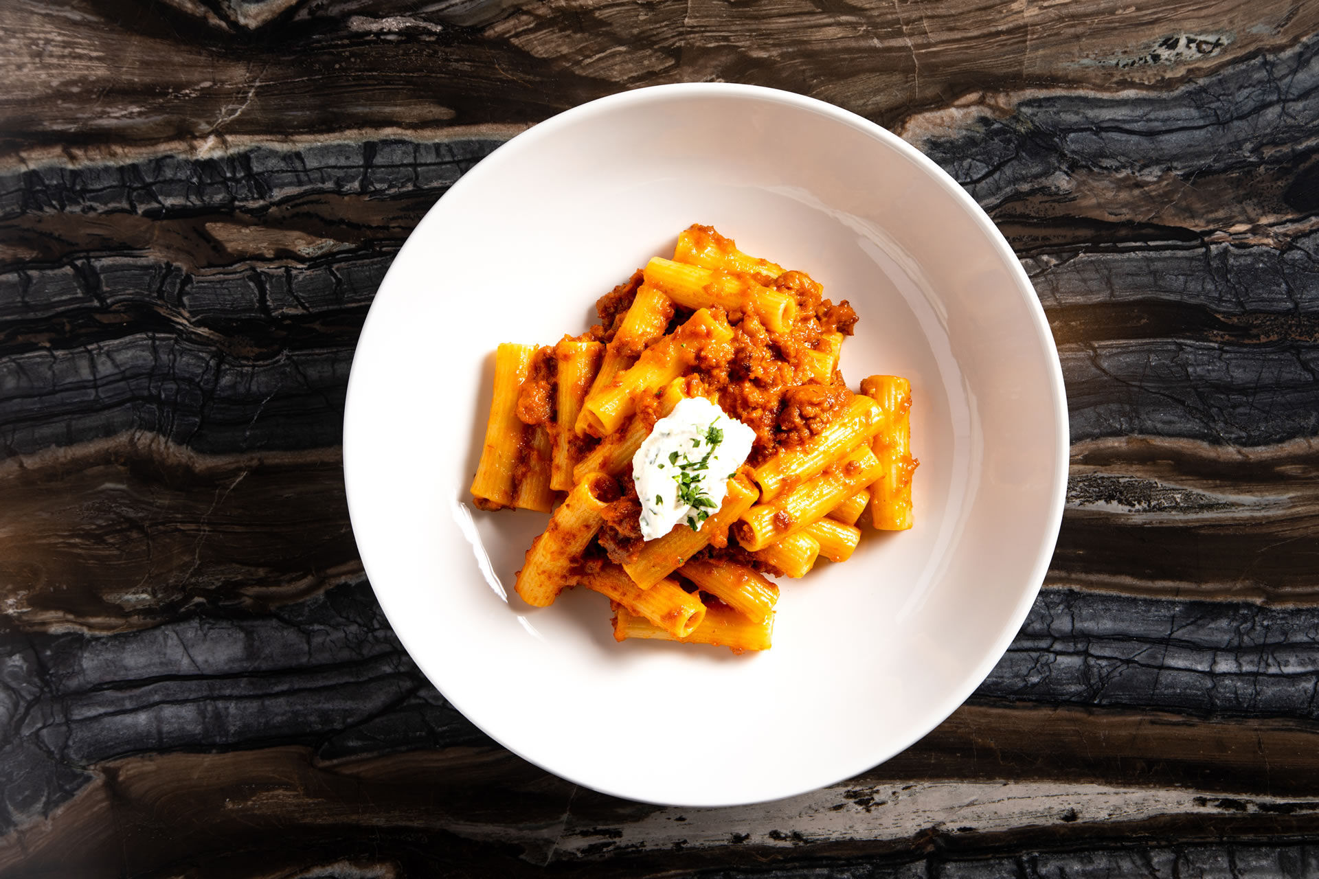 A plate of bolognese at Copper & Salt Northwest Kitchen